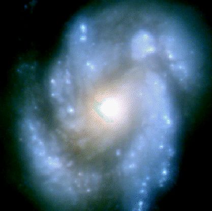Фотография спиральной галактики M100